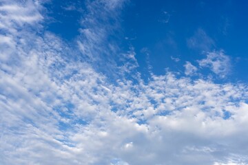 Naklejka na ściany i meble Beautiful view of cloudscape with a blue sky on a sunny day
