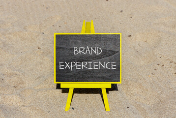 Brand experience symbol. Concept words Brand experience on black chalk blackboard on a beautiful...