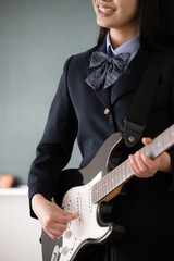 Student playing guitar Easy to use without image face of brass band or club activities Close-up of...