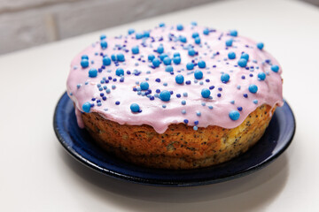 Glazed poppy easter cake with blue ...