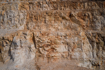 Italian marble quarries. Quarry section. Quarry wall in the mountains. marble quarries. Brown marble quarries.