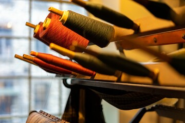 Selective shot of the spools of colorful threads