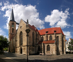 Gothic St. Martini church with bell tower and transept nave in the old town of Halberstadt,...