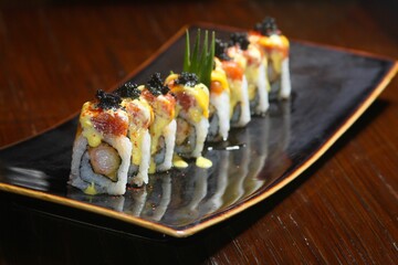Closeup of delicious fresh sushi rolls on a plate in a restaurant