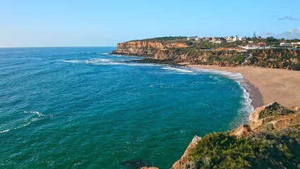 Fototapeta na wymiar Beautiful coastline seascape in Europe. Beautiful rocky seascape with rolling waves to the shore. Aerial view: beautiful nature landscape. Drone view of scenic nature in Portugal.