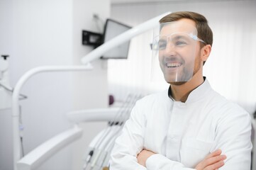 Young male dentist in clinic