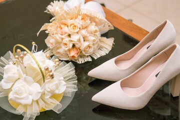 Closeup of Bride's flower and shoes for the wedding
