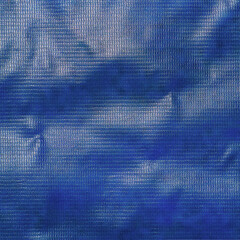 Blue banner background made of PVC plastic for design. Selective focus