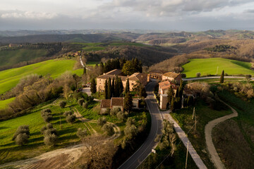 Italian countryside scenery featuring a hilltop residence in Tuscany.