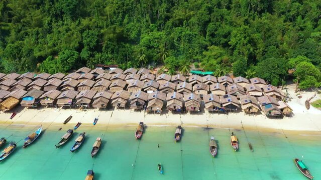 Houses of Moken tribe Village or Sea Gypsies and tropical waters of Surin Islands in Thailand, Phang Nga.	