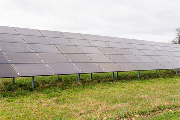 A lot of big solar panels in the field. Energy-saving ecological modern technology.