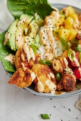 Closeup of healthy salad with vegetables and sauce