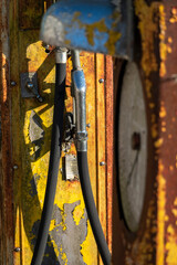 A rusty and disused petrol pump by the side of a minor road in Wiltshire, UK.  Detail