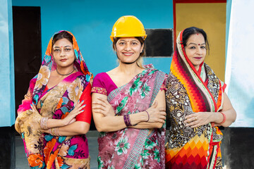 confident young indian female engineer wearing  helmet, woman empowerment. feminism employment,...