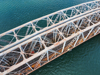 Metal railway bridge over the river