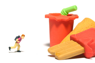 Miniature people toy figure photography. Healthy food eat and lunch break concept. A boy running...