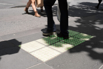 Pedestrian crossing lights embedded in the pavement for phone zombies that never look up at...