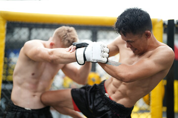Two professional boxers fighting at the gym