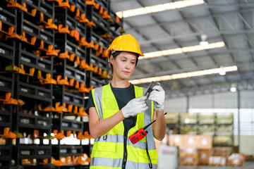 Multiethnic industrial workers checking their logistic lists while working with transportation of...