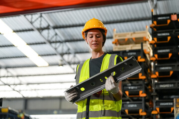 Multiethnic industrial workers checking their logistic lists while working with transportation of...