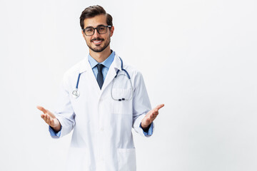 Man portrait doctor in white coat and eyeglasses and stethoscope looking into camera shows hands on background on white isolated background, space for copy, space for text, health