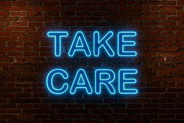 Take care, neon sign. Brick wall at night with the text 