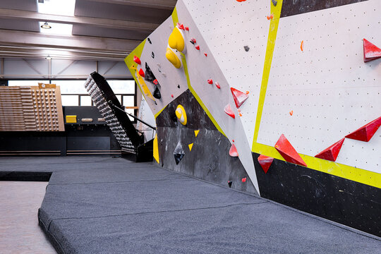 Bouldering walls with color coded grips in gym