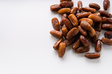 Fresh dried dates fruit on white isolated background. 