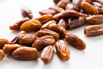 Fresh dried dates fruit on white isolated background. 