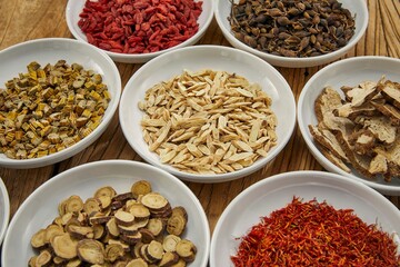 Overhead shot of some food ingredients and spices on a mahogany table