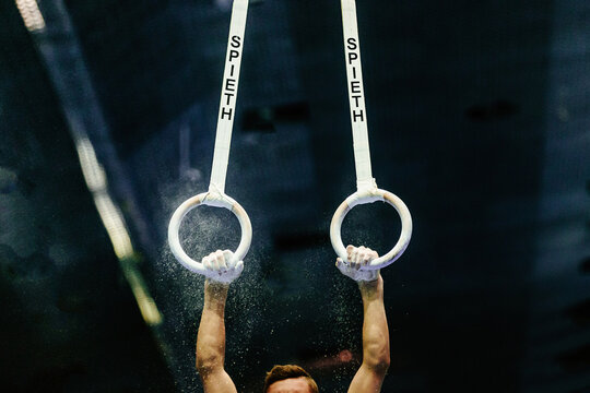 hand male gymnast exercise on ring frame in gymnastics artistic. apparatus company Spieth Germany