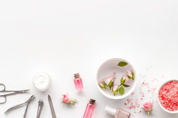Professional manicure tools with pink roses flowers. Beauty care salon spa.