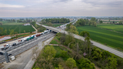 Motorway traffic jam transport cargo trucks and cars stop wait