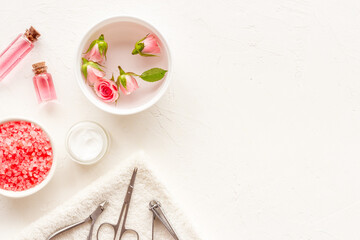 Manicure accessories with roses and towel. Beauty care salon spa.
