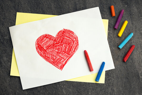 heart drawn with crayons on a white sheet of paper, children's drawing, happy mother's day, father's day