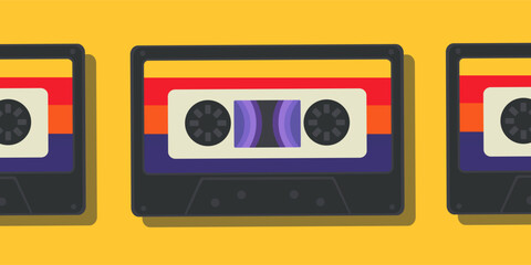 Retro audio cassettes in a row on a yellow background. Old school concept.