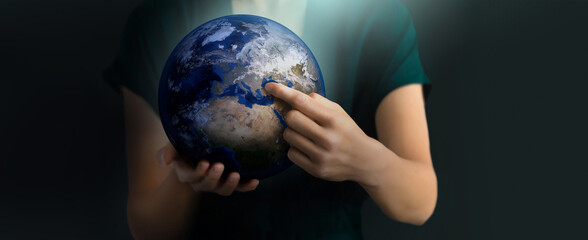 Human holds Earth planet globe. Symbolizing global unity, environmental protection, and...