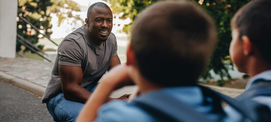 Teacher giving his students a pep talk in elementary school