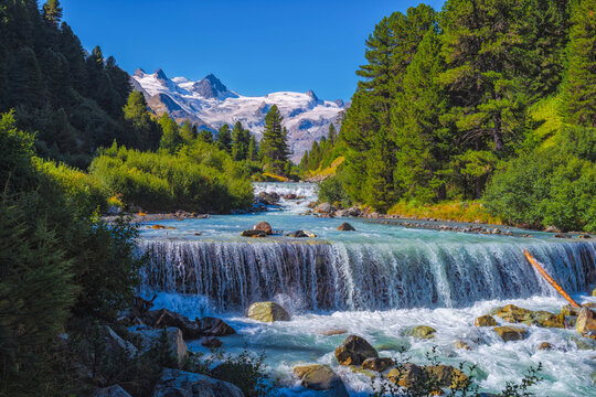 A river below the Swiss Alps - This is a favorite place for local Swiss to spend their holiday with friends and family, it's also one of my photography and hiking.