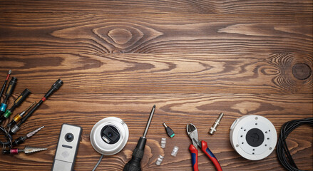 Modern white security cameras on the table with space for text. Video surveillance concept background. CCTV Installation concept. Service for installing CCTV cameras.