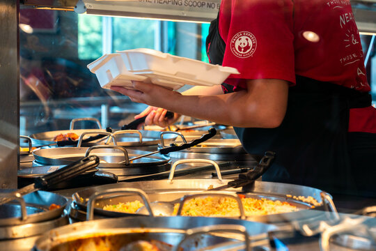 a panda express meal being prepared 