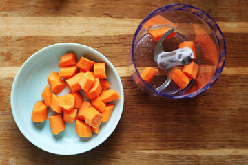 Carrot minced in blender. Cooking at home. Healthy eating