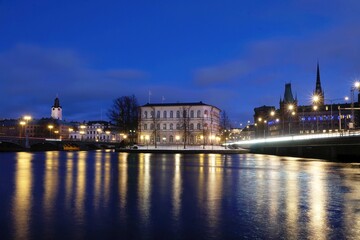 Beautiful panorama of illuminated Stockholm by night, waterfront view.  Sweden
