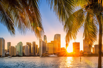 Fototapeta na wymiar Miami, Florida skyline with sunbeams shining through the skyscrapers. Miami is a majority-minority city and a major center and leader in finance, commerce, culture, arts, and international trade.