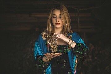 Future telling. Gypsy woman with altar, candles magic, clean aura and negative energy, wicca concept