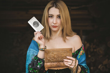 Future telling. Gypsy woman with altar, candles magic, clean aura and negative energy, wicca concept