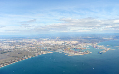 Aerial view of the Port of Valencia with the city in the background, Valencian Community, Spain. Valencia and its port on the Mediterranean Sea.