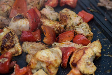 view of chicken being cooked on a griddle