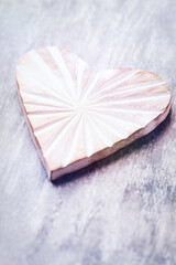 Wooden Heart on bright wooden background. Close up. Copy space.                                                                                                                                         