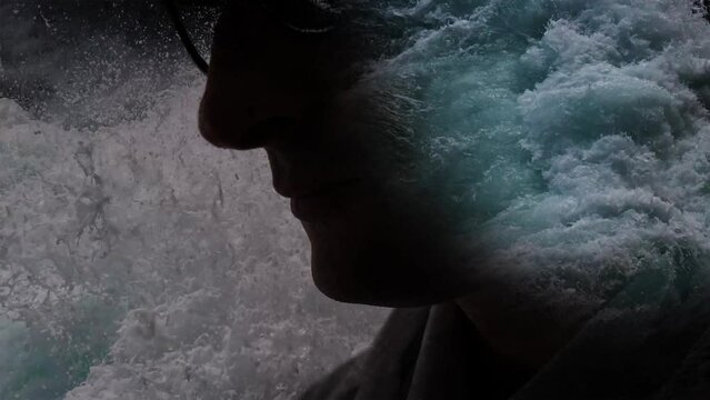 Male profile among the raging sea waves. Visualization of mental disorder and instability. Cg